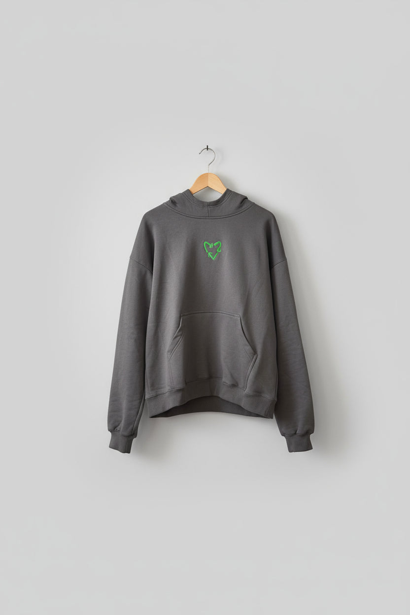 Gray hoodie with green logo on a textured brown background with 'Sustainable Trash' text